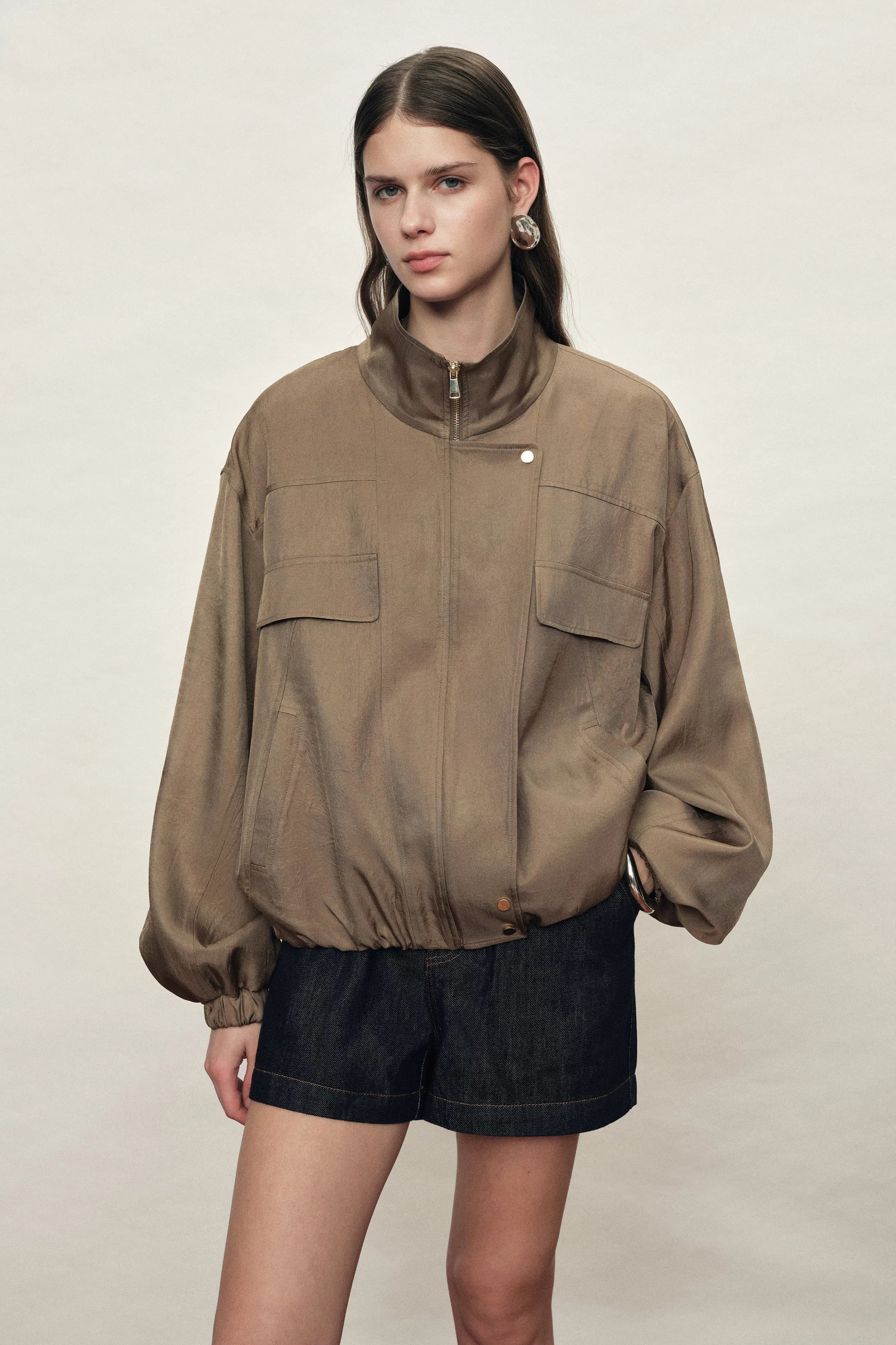 Women's brown satin jacket with stand collar, flap pockets and bubble hem