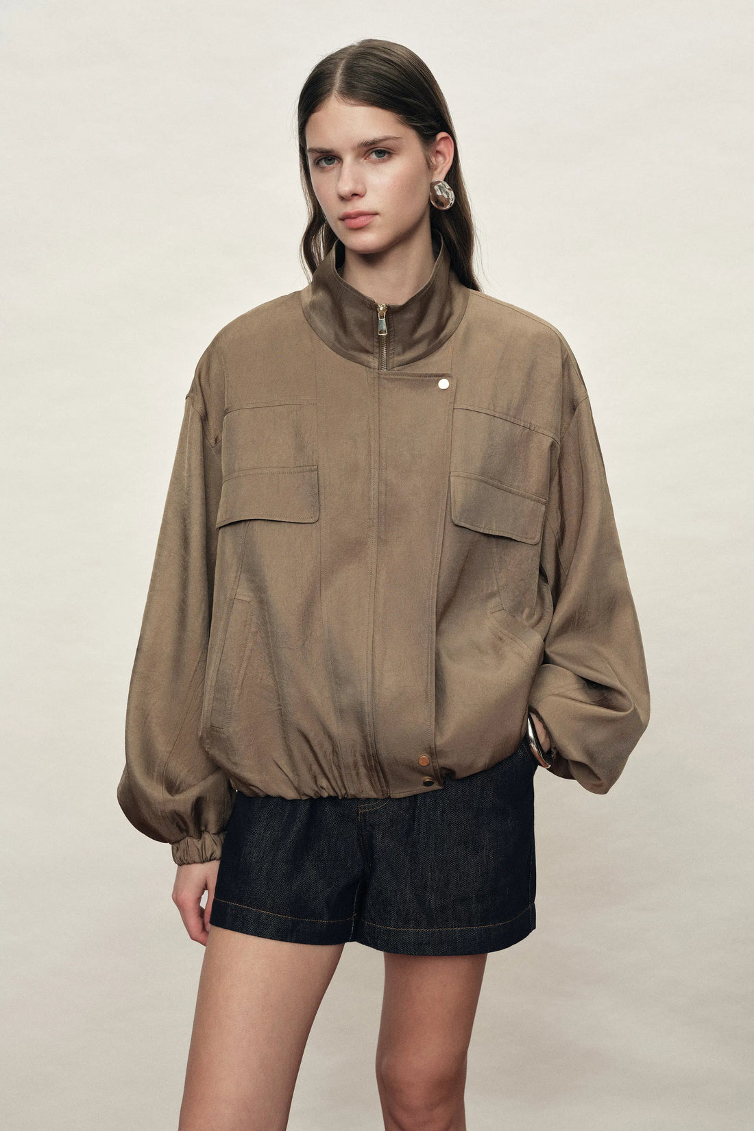 Women's brown satin jacket with stand collar, flap pockets and bubble hem